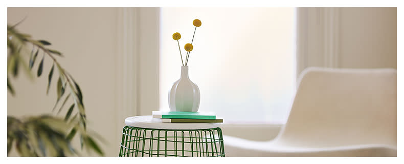 a DIY table made from a waste paper basket